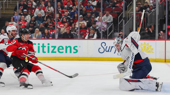 Washington Capitals goaltender Logan Thompson (48) makes a save on New Jersey Devils left wing Jesper Bratt (63): Ed Mulholland-Imagn Images