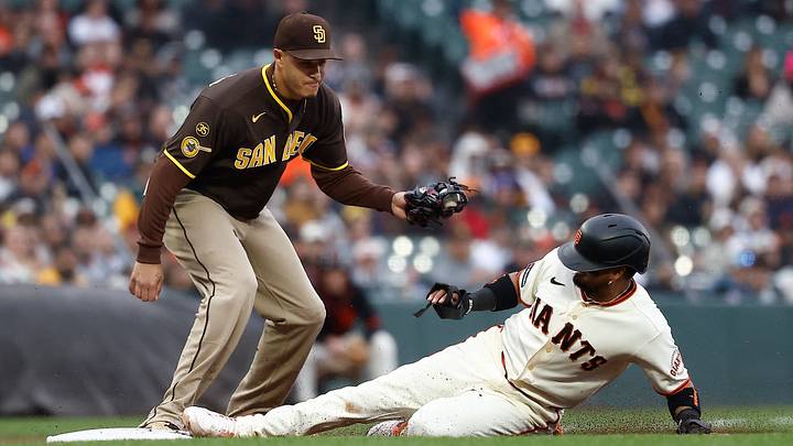 May 4, 2026; San Francisco, California, USA; San Francisco Giants second baseman Luis Arraez (1) slides safely to third base against San Diego Padres third baseman Manny Machado (13) during the first inning at Oracle Park. Mandatory Credit: Kelley L Cox-Imagn Images May 4, 2026; San Francisco, California, USA; San Francisco Giants second baseman Luis Arraez (1) slides safely to third base against San Diego Padres third baseman Manny Machado (13) during the first inning at Oracle Park. Mandatory Credit: Kelley L Cox-Imagn Images