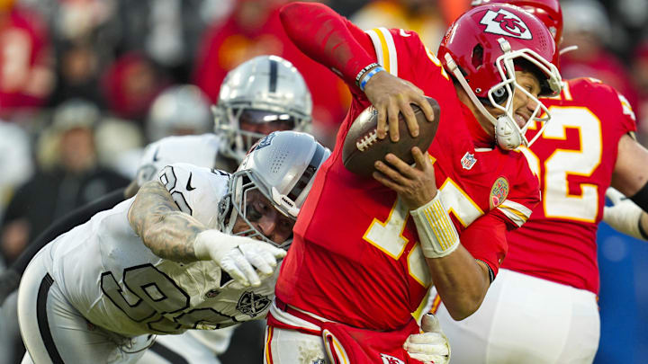 Nov 29, 2024; Kansas City, Missouri, USA; Kansas City Chiefs quarterback Patrick Mahomes (15) scrambles from Las Vegas Raiders defensive end Maxx Crosby (98) during the second half at GEHA Field at Arrowhead Stadium. Mandatory Credit: Jay Biggerstaff-Imagn Images Nov 29, 2024; Kansas City, Missouri, USA; Kansas City Chiefs quarterback Patrick Mahomes (15) scrambles from Las Vegas Raiders defensive end Maxx Crosby (98) during the second half at GEHA Field at Arrowhead Stadium. Mandatory Credit: Jay Biggerstaff-Imagn Images