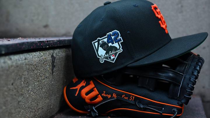 Apr 15, 2026; Cincinnati, Ohio, USA;  A view of a Giants game hat on the dugout steps, with a patch honoring Jackie Robinson during the game between the San Francisco Giants and the Cincinnati Reds at Great American Ball Park. Players and coaches will wear No. 42 in honor of Jackie Robinson Day around the league. Mandatory Credit: Aaron Doster-Imagn Images