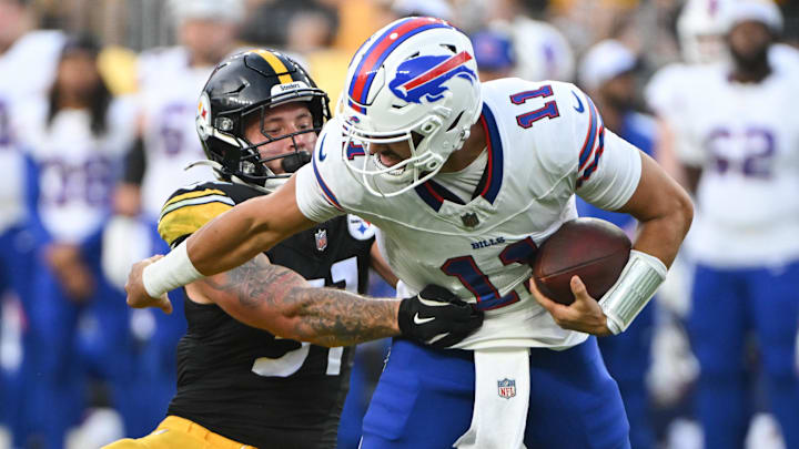 Aug 17, 2024; Pittsburgh, Pennsylvania, USA;  Pittsburgh Steelers linebacker Nick Herbig (51) tackles Buffalo Bills quarterback Mitchell Trubisky (11) during the first quarter at Acrisure Stadium