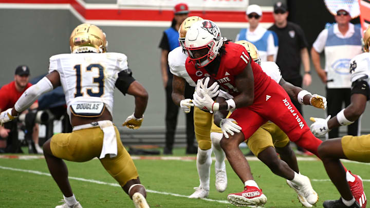 Sep 9, 2023; Raleigh, North Carolina, USA; North Carolina State Wolfpack tight end Juice Vereen (12) runs after a a catch during the second half against the Notre Dame Fighting Irish at Carter-Finley Stadium. Mandatory Credit: Rob Kinnan-Imagn Images
