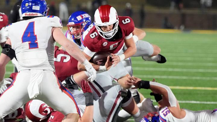 Owasso quarterback Drew Frankenfield (with ball) dives forward in the 2025 Class 6A-I championship game against Bixby. Owasso quarterback Drew Frankenfield (with ball) dives forward in the 2025 Class 6A-I championship game against Bixby.