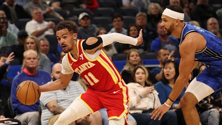 Atlanta Hawks guard Trae Young (11) drives to the basket as  Orlando Magic guard Jalen Suggs (4) defends during the first quarter at Kia Center.
