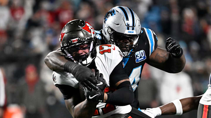 Dec 1, 2024; Charlotte, North Carolina, USA; Tampa Bay Buccaneers wide receiver Sterling Shepard (17) is tackled by Carolina Panthers defensive end A'Shawn Robinson (94) in the fourth quarter at Bank of America Stadium. Mandatory Credit: Bob Donnan-Imagn Images Dec 1, 2024; Charlotte, North Carolina, USA; Tampa Bay Buccaneers wide receiver Sterling Shepard (17) is tackled by Carolina Panthers defensive end A'Shawn Robinson (94) in the fourth quarter at Bank of America Stadium. Mandatory Credit: Bob Donnan-Imagn Images