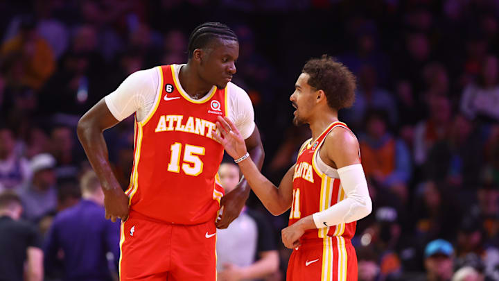 Feb 1, 2023; Phoenix, Arizona, USA; Atlanta Hawks center Clint Capela (15) with guard Trae Young (11) against the Phoenix Suns at Footprint Center. Mandatory Credit: Mark J. Rebilas-Imagn Images