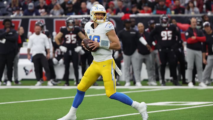 Jan 11, 2025; Houston, Texas, USA; Los Angeles Chargers quarterback Justin Herbert (10) drops back in the pocket in the first quarter against the Houston Texans in an AFC wild card game at NRG Stadium. Mandatory Credit: Thomas Shea-Imagn Images