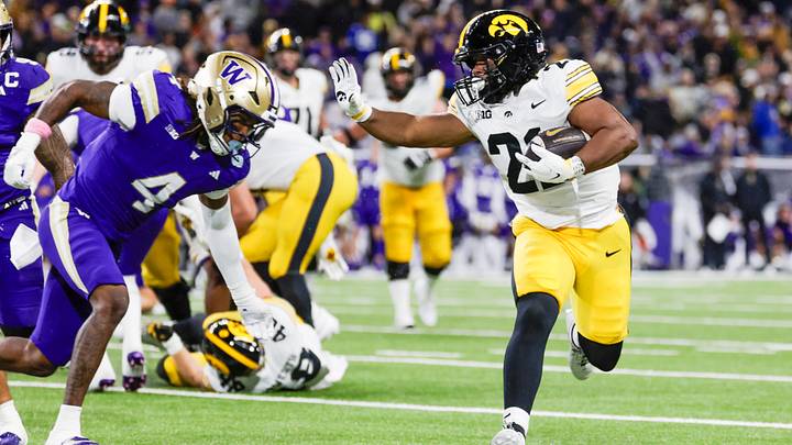 Oct 9, 2026; Seattle, Washington, USA; Iowa Hawkeyes running back L.J. Phillips Jr. (21) rushes against the Washington Huskies during the third quarter at Husky Stadium. Mandatory Credit: Joe Nicholson-Imagn Images