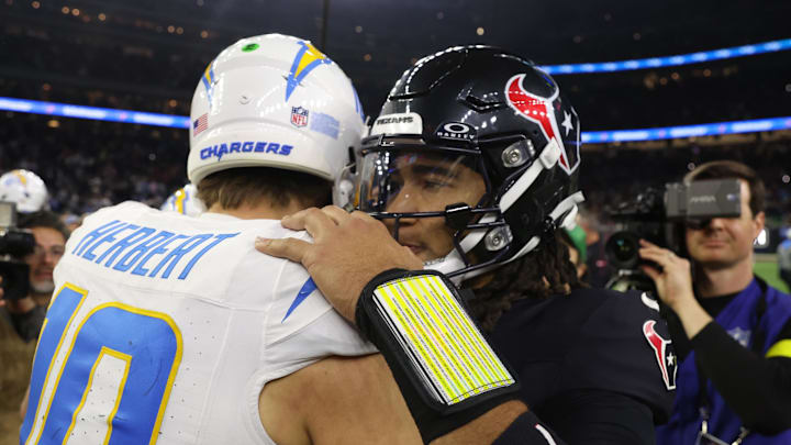 Jan 11, 2025; Houston, Texas, USA; Houston Texans quarterback C.J. Stroud (7) and Los Angeles Chargers quarterback Justin Herbert (10) after defeating the Los Angeles Chargers in an AFC wild card game at NRG Stadium. Mandatory Credit: Thomas Shea-Imagn Images
