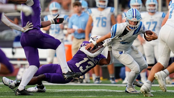 St. Francis DeSales running back tackles Olentangy Berlin quarterback during Week 1 of high school football at DeSales High School on Aug. 22, 2025.