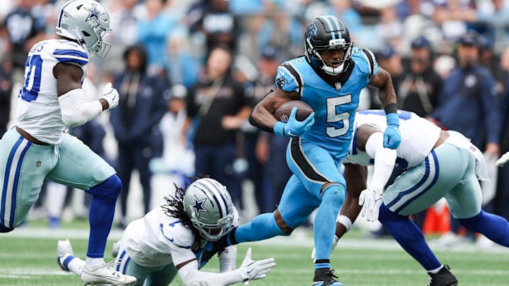 Oct 12, 2025; Charlotte, North Carolina, USA; Carolina Panthers running back Rico Dowdle (5) runs with the ball during the second half against the Dallas Cowboys at Bank of America Stadium. Mandatory Credit: Cory Knowlton-Imagn Images