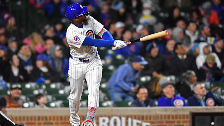 Apr 20, 2024; Chicago, Illinois, USA; Chicago Cubs outfielder Alexander Canario (4) hits a home run during the sixth inning against the Miami Marlins at Wrigley Field. Mandatory Credit: Patrick Gorski-Imagn Images