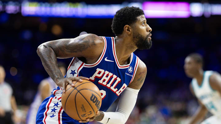 Philadelphia 76ers forward Paul George (8) controls the ball against the Charlotte Hornets during the fourth quarter at Wells Fargo Center. Mandatory Credit: Bill Streicher-Imagn Images