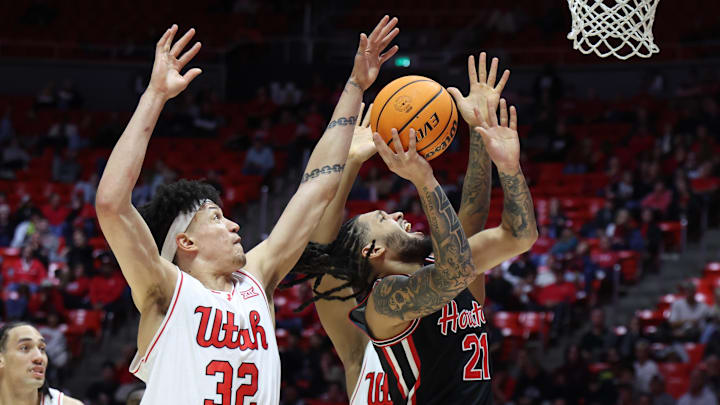 Feb 10, 2026; Salt Lake City, Utah, USA; Houston Cougars guard Emanuel Sharp (21) goes to the basket against Utah Utes forward James Okonkwo (32) during the first half at Jon M. Huntsman Center. 