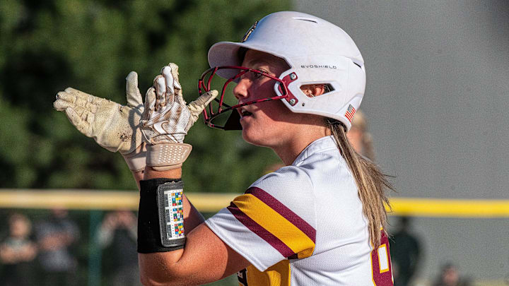 Farmington Hills Mercy's Charlie Lambert celebrates getting on base during the Division 1 softball quarterfinal on Tuesday, June 11, 2024, at Wayne State University.