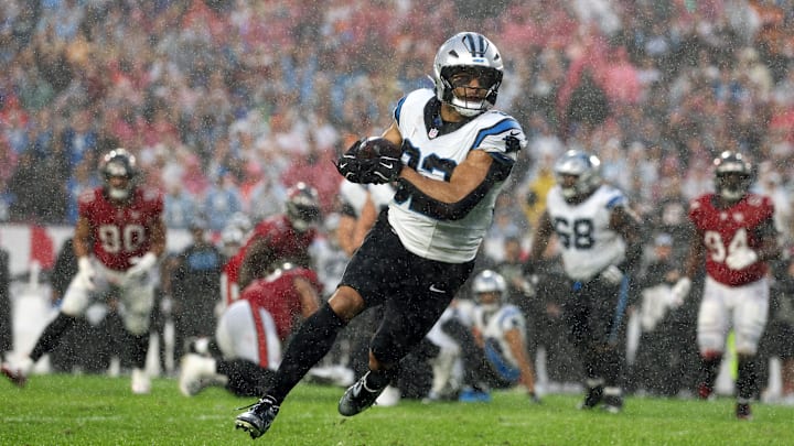 Jan 3, 2026; Tampa, Florida, USA; Carolina Panthers tight end Tommy Tremble (82) runs to score a touchdown against the Tampa Bay Buccaneers in the first half at Raymond James Stadium. Mandatory Credit: Nathan Ray Seebeck-Imagn Images Jan 3, 2026; Tampa, Florida, USA; Carolina Panthers tight end Tommy Tremble (82) runs to score a touchdown against the Tampa Bay Buccaneers in the first half at Raymond James Stadium. Mandatory Credit: Nathan Ray Seebeck-Imagn Images