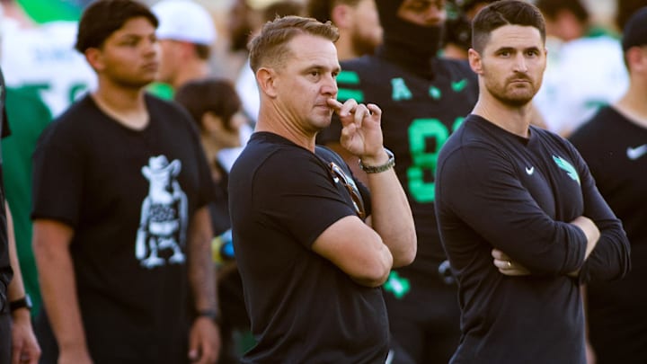 Oct 10, 2025; Denton, Texas, USA; North Texas Mean Green head coach Eric Morris watches his team warm up prior to a game against the South Florida Bulls at DATCU Stadium. Mandatory Credit: Raymond Carlin III-Imagn Images