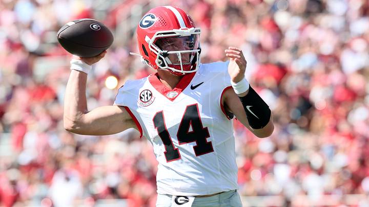 Sep 19, 2026; Fayetteville, Arkansas, USA;  Georgia Bulldogs quarterback Gunner Stockton (14) passes the ball against the Arkansas Razorbacks during the first half at Donald W. Reynolds Razorback Stadium.  Mandatory Credit: Nelson Chenault-Imagn Images