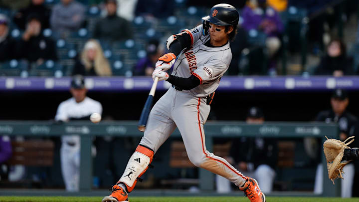 May 7, 2024; Denver, Colorado, USA; San Francisco Giants center fielder Jung Hoo Lee (51) hits a single in the fourth inning against the Colorado Rockies at Coors Field. May 7, 2024; Denver, Colorado, USA; San Francisco Giants center fielder Jung Hoo Lee (51) hits a single in the fourth inning against the Colorado Rockies at Coors Field.