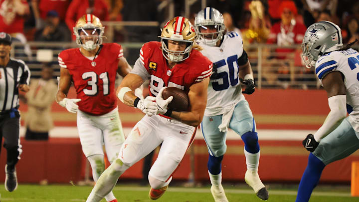 Oct 27, 2024; Santa Clara, California, USA; San Francisco 49ers tight end George Kittle (85) carries the ball against the Dallas Cowboys during the second quarter at Levi's Stadium. Mandatory Credit: Kelley L Cox-Imagn Images