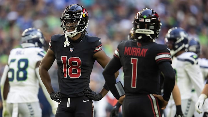 Dec 8, 2024; Glendale, Arizona, USA; Arizona Cardinals wide receiver Marvin Harrison Jr. (18) alongside quarterback Kyler Murray (1) against the Seattle Seahawks in the first half at State Farm Stadium. Mandatory Credit: Mark J. Rebilas-Imagn Images