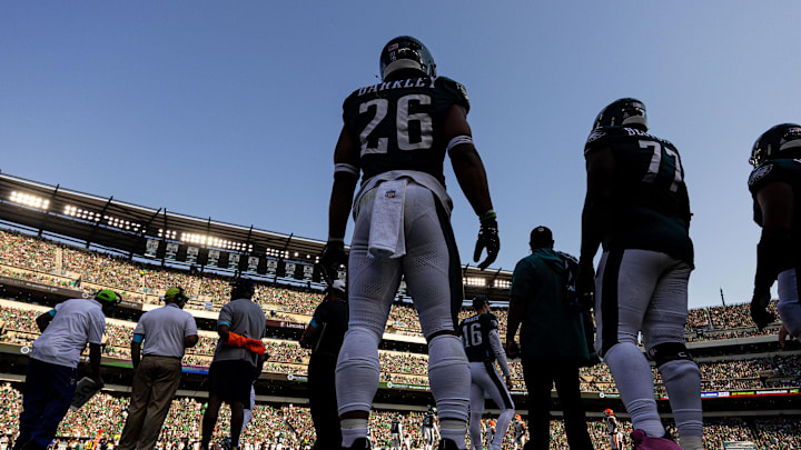 Oct 13, 2024; Philadelphia, Pennsylvania, USA; Philadelphia Eagles running back Saquon Barkley (26) looks on from the sideline in a game against the Cleveland Browns during the third quarter at Lincoln Financial Field. Mandatory Credit: Bill Streicher-Imagn Images