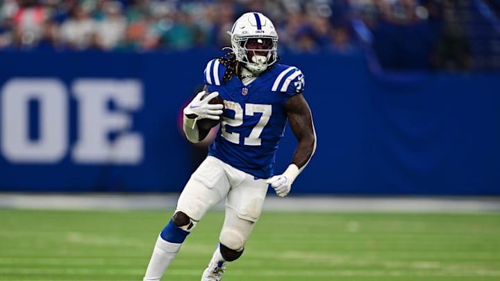 Oct 20, 2024; Indianapolis, Indiana, USA; Indianapolis Colts running back Trey Sermon (27) runs the ball during the second half against the Miami Dolphins at Lucas Oil Stadium. Mandatory Credit: Marc Lebryk-Imagn Images