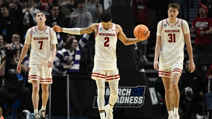 Wisconsin Badgers guard Andrew Rohde (7), guard Nick Boyd (2), and forward Nolan Winter (31).