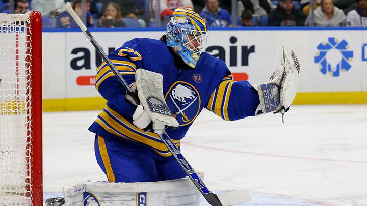 Jan 9, 2024; Buffalo, New York, USA;  Buffalo Sabres goaltender Devon Levi (27) makes a glove save during the third period against the Seattle Kraken at KeyBank Center. Mandatory Credit: Timothy T. Ludwig-USA TODAY Sports