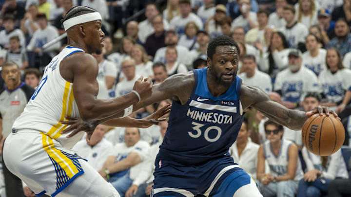 May 8, 2025; Minneapolis, Minnesota, USA; Minnesota Timberwolves forward Julius Randle (30) dribbles the ball past Golden State Warriors forward Jimmy Butler III (10) in the first half during game two of the second round for the 2025 NBA Playoffs at Target Center. Mandatory Credit: Jesse Johnson-Imagn Images May 8, 2025; Minneapolis, Minnesota, USA; Minnesota Timberwolves forward Julius Randle (30) dribbles the ball past Golden State Warriors forward Jimmy Butler III (10) in the first half during game two of the second round for the 2025 NBA Playoffs at Target Center. Mandatory Credit: Jesse Johnson-Imagn Images
