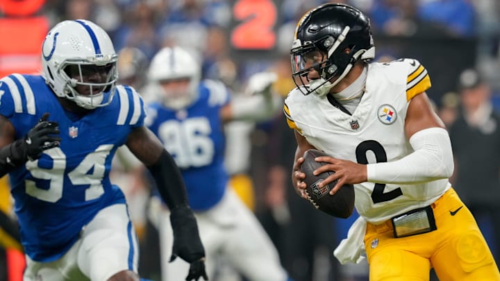 Pittsburgh Steelers quarterback Justin Fields (2) scrambles with the ball as Indianapolis Colts defensive end Tyquan Lewis (94) gives chase Sunday, Sept. 29, 2024, during a game at Lucas Oil Stadium in Indianapolis. Pittsburgh Steelers quarterback Justin Fields (2) scrambles with the ball as Indianapolis Colts defensive end Tyquan Lewis (94) gives chase Sunday, Sept. 29, 2024, during a game at Lucas Oil Stadium in Indianapolis.