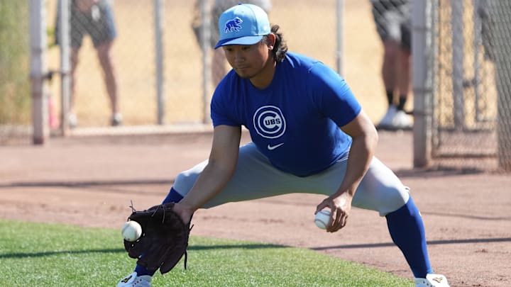 Feb 10, 2025; Mesa, AZ, USA; Chicago Cubs pitcher Shota Imanaga (18) runs through drills during spring training camp. 