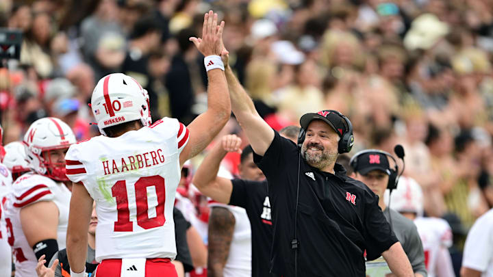 Sep 28, 2024; West Lafayette, Indiana, USA; Nebraska Cornhuskers head coach Matt Rhule high fives quarterback Heinrich Haarberg (10) during the first quarter against the Purdue Boilermakers at Ross-Ade Stadium. Sep 28, 2024; West Lafayette, Indiana, USA; Nebraska Cornhuskers head coach Matt Rhule high fives quarterback Heinrich Haarberg (10) during the first quarter against the Purdue Boilermakers at Ross-Ade Stadium.
