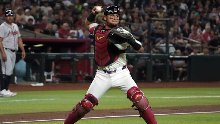 Jul 8, 2024; Phoenix, Arizona, USA; Arizona Diamondbacks catcher Gabriel Moreno (14) throws down to first base for the out against the Atlanta Braves in the sixth inning at Chase Field. Mandatory Credit: Rick Scuteri-Imagn Images
