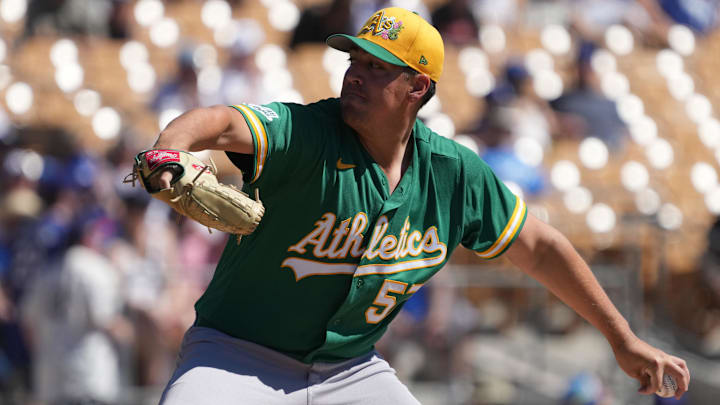 Mar 21, 2026; Phoenix, Arizona, USA; Athletics pitcher Jacob Lopez (57) throws against the Los Angeles Dodgers in the first inning at Camelback Ranch-Glendale. Mandatory Credit: Rick Scuteri-Imagn Images