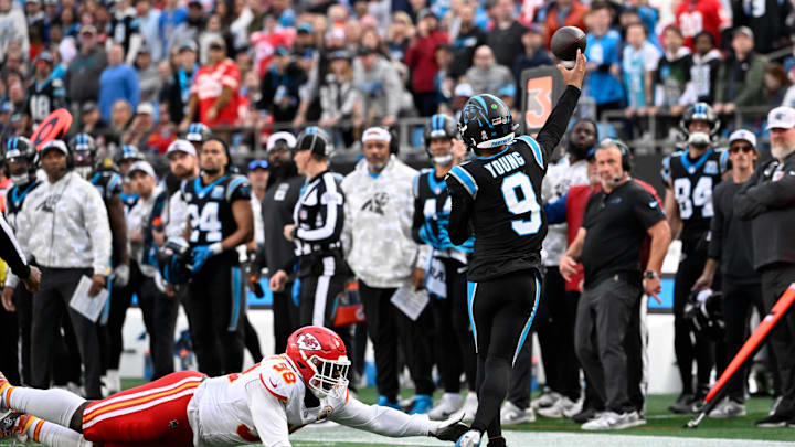 Nov 24, 2024; Charlotte, North Carolina, USA; Carolina Panthers quarterback Bryce Young (9) passes the ball as Kansas City Chiefs defensive tackle Tershawn Wharton (98) pressures in the fourth quarter at Bank of America Stadium. Mandatory Credit: Bob Donnan-Imagn Images