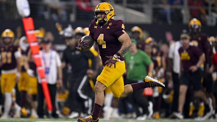 Arizona State Sun Devils running back Cam Skattebo (4) runs with the ball against the Iowa State Cyclones during the first half at AT&T Stadium. Arizona State Sun Devils running back Cam Skattebo (4) runs with the ball against the Iowa State Cyclones during the first half at AT&T Stadium.