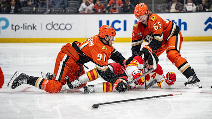 Mar 1, 2026; Anaheim, California, USA; Anaheim Ducks center Leo Carlsson (91) and Anaheim Ducks defenseman Jacob Trouba (65) with Calgary Flames center Nazem Kadri (91) during the third period at Honda Center. Mandatory Credit: Corinne Votaw-Imagn Images Mar 1, 2026; Anaheim, California, USA; Anaheim Ducks center Leo Carlsson (91) and Anaheim Ducks defenseman Jacob Trouba (65) with Calgary Flames center Nazem Kadri (91) during the third period at Honda Center. Mandatory Credit: Corinne Votaw-Imagn Images