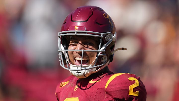 Sep 28, 2024; Los Angeles, California, USA; Southern California Trojans wide receiver Duce Robinson (2) celebrates after scoring on an 8-yard touchdown reception against the Wisconsin Badgersin the second half at United Airlines Field at Los Angeles Memorial Coliseum. Mandatory Credit: Kirby Lee-Imagn Images