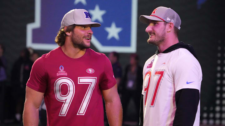 Jan 30, 2025; Orlando, FL, USA; NFC defensive end Nick Bosa of the San Francisco 49ers (left) with brother and AFC linebacker Joey Bosa during the Pro Bowl Skills Challenge at Nicholson Fieldhouse. Mandatory Credit: Kirby Lee-Imagn Images