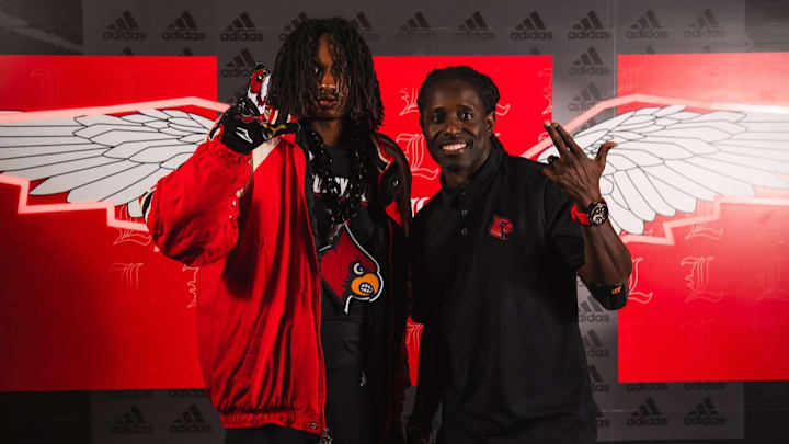 Tampa (Fla.) Carrollwood wide receiver/cornerback D.J. Williams and Louisville wide receiver coach Deion Branch