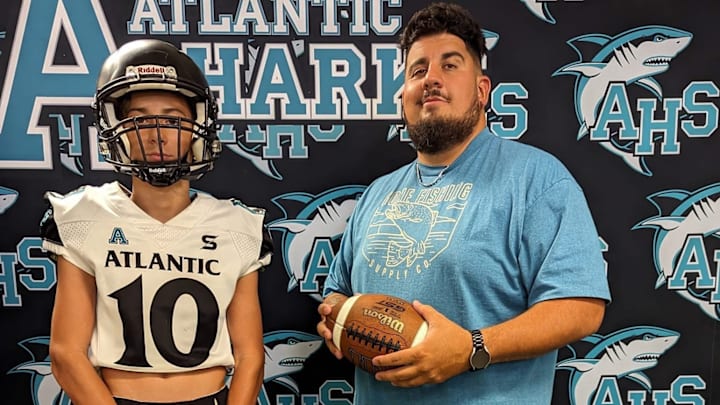 Ex-Marine and former Atlantic High School assistant coach, Saul Rodriguez, has been named the Sharks' new varsity coach.