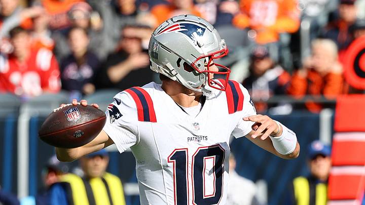 Nov 10, 2024; Chicago, Illinois, USA; New England Patriots quarterback Drake Maye (10) drops back to pass against the Chicago Bears during the first quarter at Soldier Field. Mandatory Credit: Mike Dinovo-Imagn Images