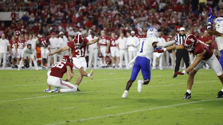Conor Talty kicking against Middle Tennessee State.