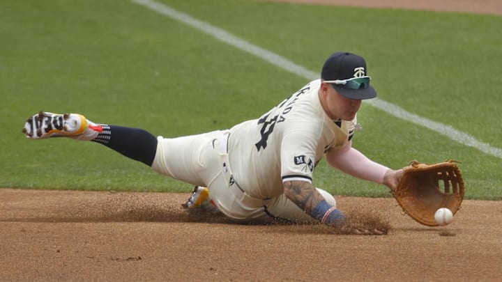 Aug 4, 2024; Minneapolis, Minnesota, USA; Minnesota Twins first baseman Jose Miranda (64) fields a ball hit by Chicago White Sox shortstop Nicky Lopez (not pictured) in the second inning at Target Field.