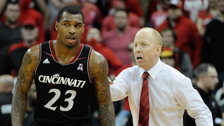 Jan 30, 2014; Louisville, KY, USA; Cincinnati Bearcats head coach Mick Cronin talks with guard Sean Kilpatrick (23) during the second half against the Louisville Cardinals at KFC Yum! Center. Cincinnati defeated Louisville 69-66. Mandatory Credit: Jamie Rhodes-Imagn Images Jan 30, 2014; Louisville, KY, USA; Cincinnati Bearcats head coach Mick Cronin talks with guard Sean Kilpatrick (23) during the second half against the Louisville Cardinals at KFC Yum! Center. Cincinnati defeated Louisville 69-66. Mandatory Credit: Jamie Rhodes-Imagn Images
