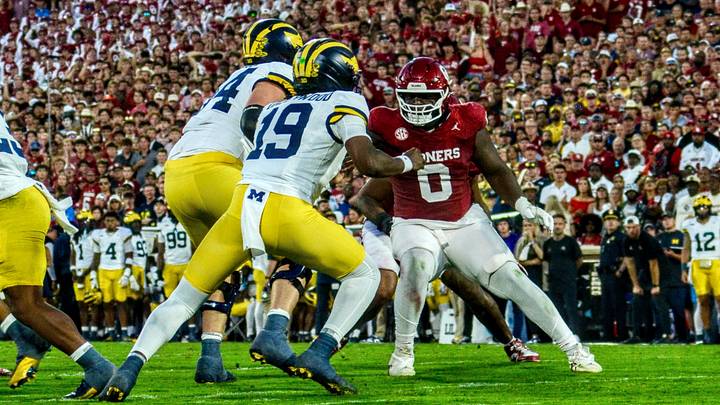 Oklahoma defensive lineman David Stone looks to contain Michigan's Bryce Underwood. Oklahoma defensive lineman David Stone looks to contain Michigan's Bryce Underwood.