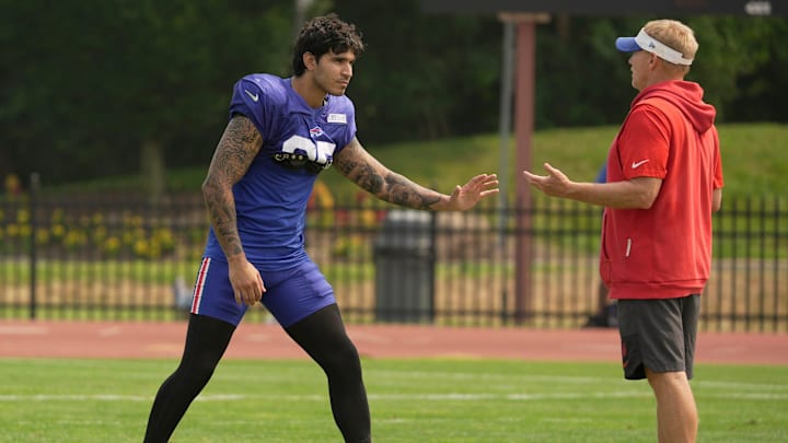 Buffalo Bills linebacker Jimmy Ciarlo stays after practice for advice from special teams coordinator Chris Tabor at Bills Training Camp.