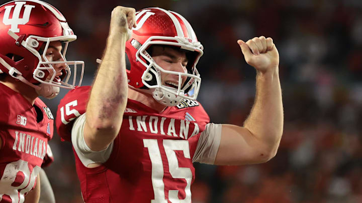 Indiana Hoosiers quarterback Fernando Mendoza (15) celebrates after scoring a touchdown against the Miami Hurricanes in the fourth quarter during the College Football Playoff National Championship game at Hard Rock Stadium. Mandatory Credit: Sam Navarro-Imagn Images