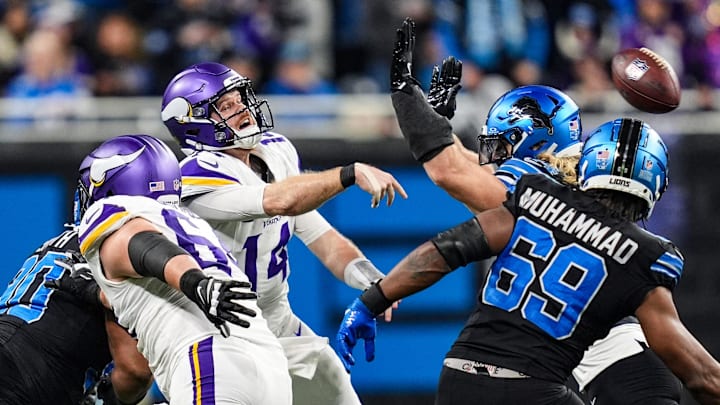 Minnesota Vikings quarterback Sam Darnold (14) is pressured by Detroit Lions Alex Anzalone (34) and Al-Quadin Muhammad (69). Minnesota Vikings quarterback Sam Darnold (14) is pressured by Detroit Lions Alex Anzalone (34) and Al-Quadin Muhammad (69).